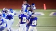 A screenshot from a video shows a referee being hit by a Texas high school football player during a game on Friday, Sept. 4, 2015. (Credit: Greg Gibson/YouTube)