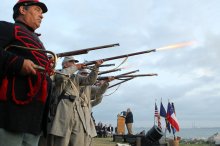 Civil War re-enactors fire a salute near Fort Sumter to commemorate the moment the first shots of the Civil War on April 12, 2011.