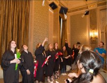 Class of 2015 graduates throw their caps in the air