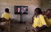 Students at the Pencils of Promise Omega School in Ghana talk to Adam Braun and Sugata Mitra remotely. Photo: Microsoft Work Wonders Project